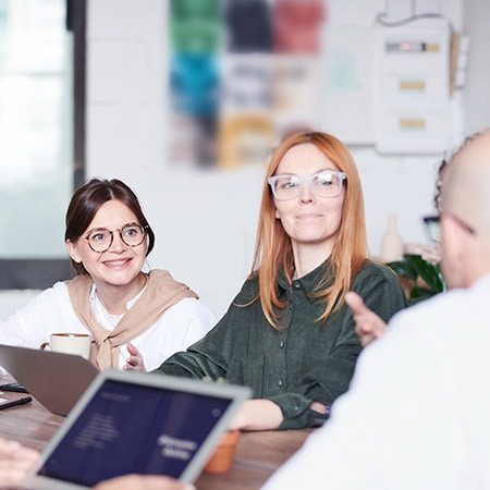 Team collaboration at a table.